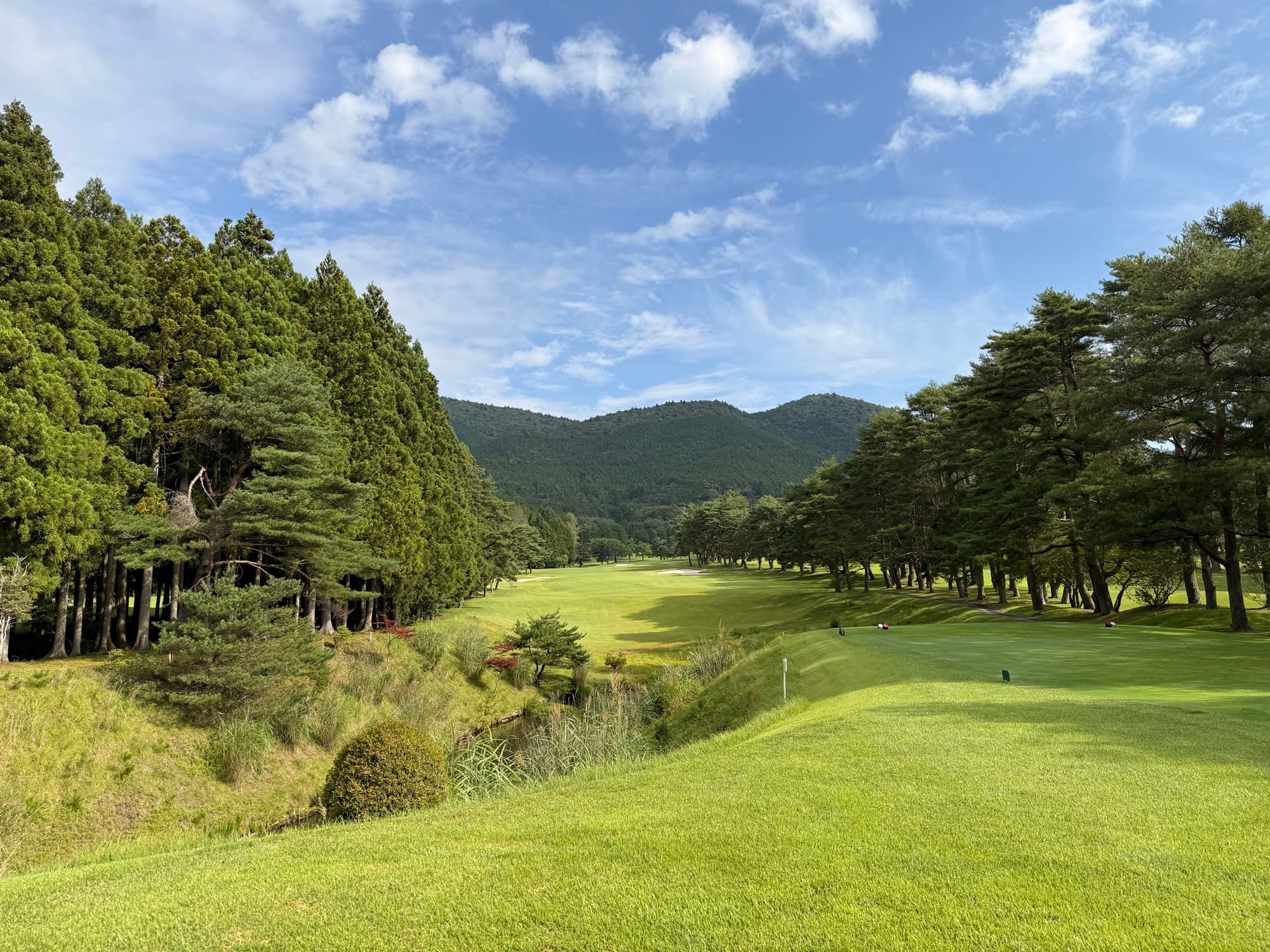 A fairway at Kagosaka falling away toward the mountains